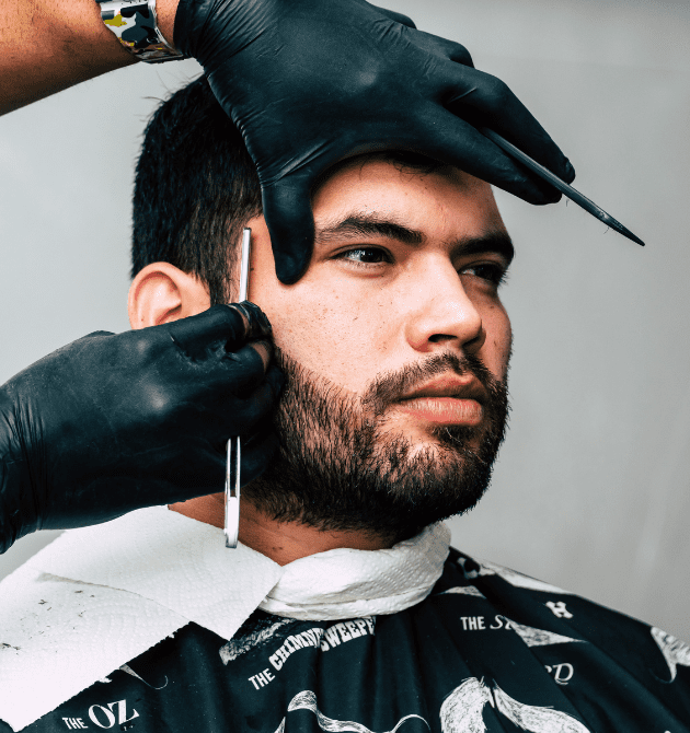 Representation of a man getting a haircut.